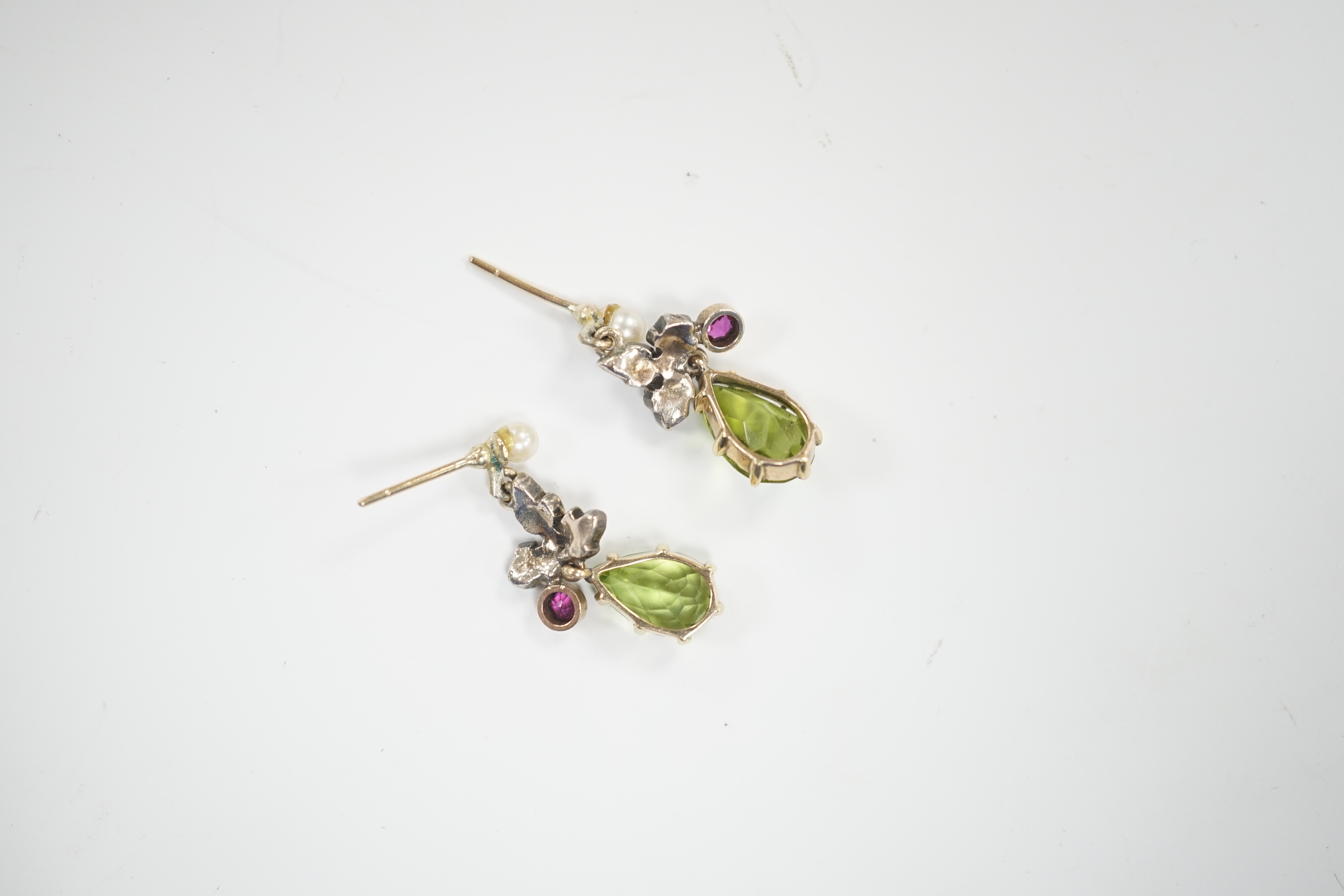 A pair of yellow metal, peridot, red stone, cultured pearl and rose diamond cluster set drop earrings, 25mm, gross weight 3.9 grams.